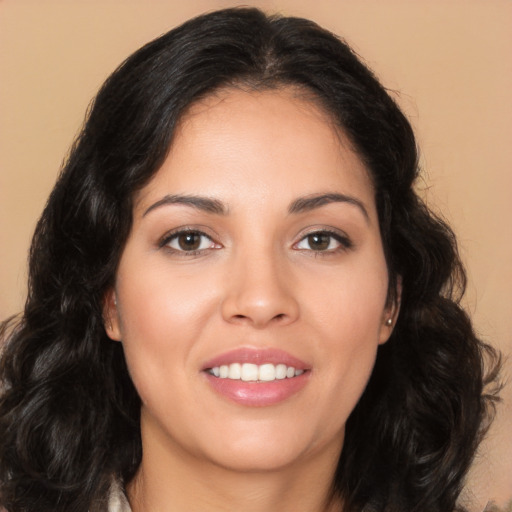 Joyful latino young-adult female with long  brown hair and brown eyes