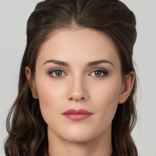 Neutral white young-adult female with long  brown hair and brown eyes