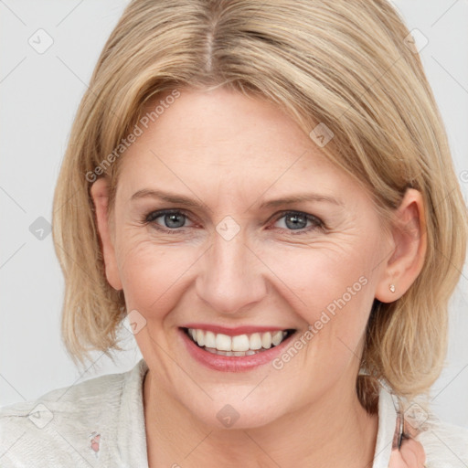 Joyful white adult female with medium  brown hair and grey eyes