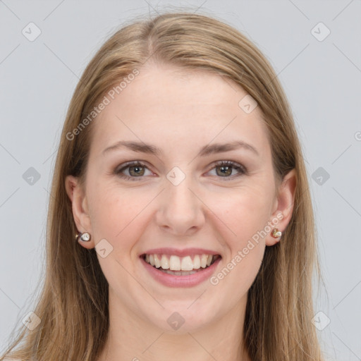 Joyful white young-adult female with long  brown hair and grey eyes