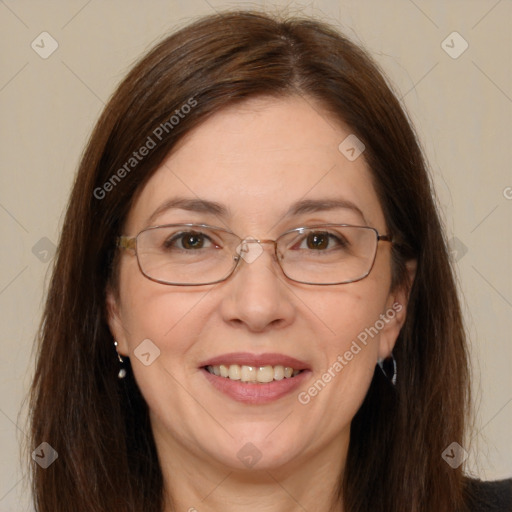 Joyful white adult female with long  brown hair and brown eyes