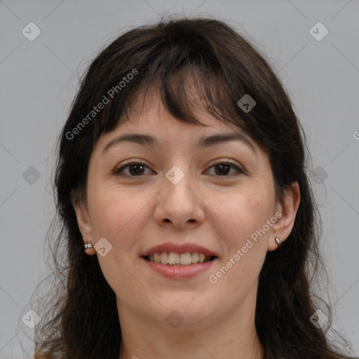 Joyful white adult female with long  brown hair and brown eyes