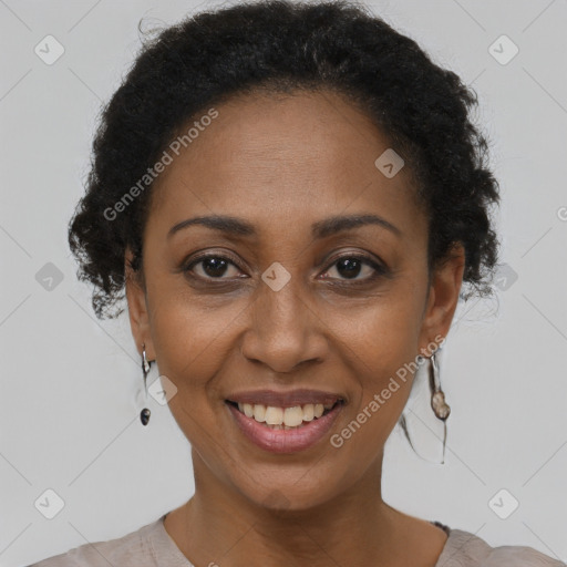 Joyful black adult female with short  brown hair and brown eyes