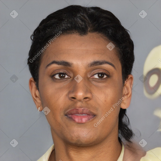 Joyful latino young-adult female with short  black hair and brown eyes