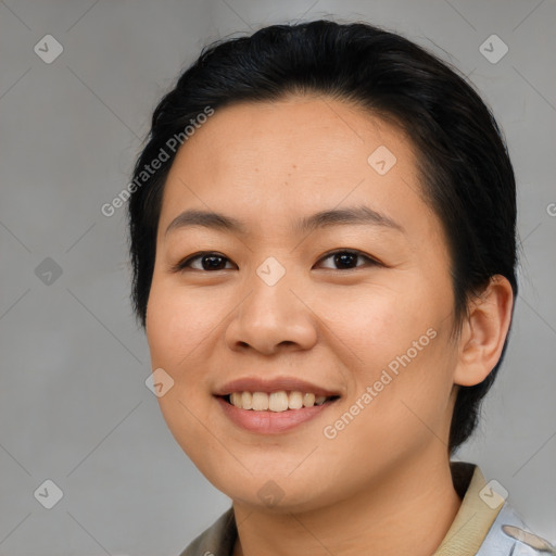 Joyful asian young-adult female with medium  black hair and brown eyes