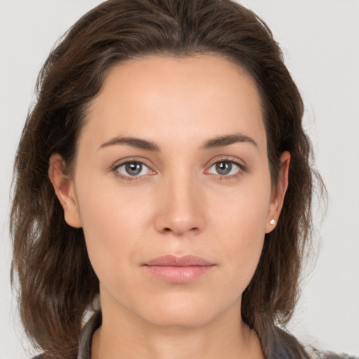 Neutral white young-adult female with medium  brown hair and brown eyes