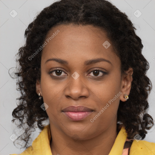 Joyful black young-adult female with medium  brown hair and brown eyes