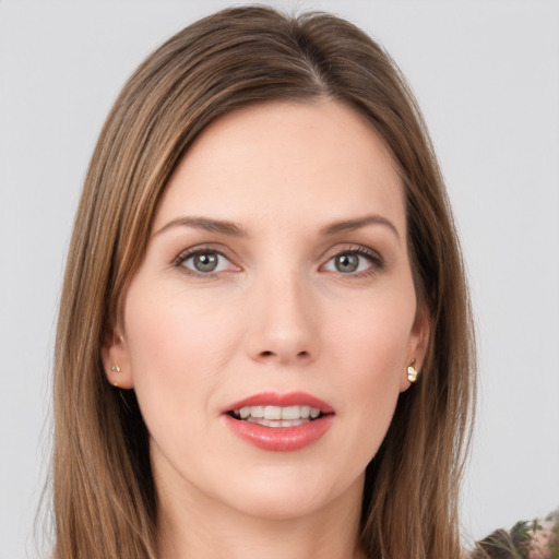 Joyful white young-adult female with long  brown hair and green eyes