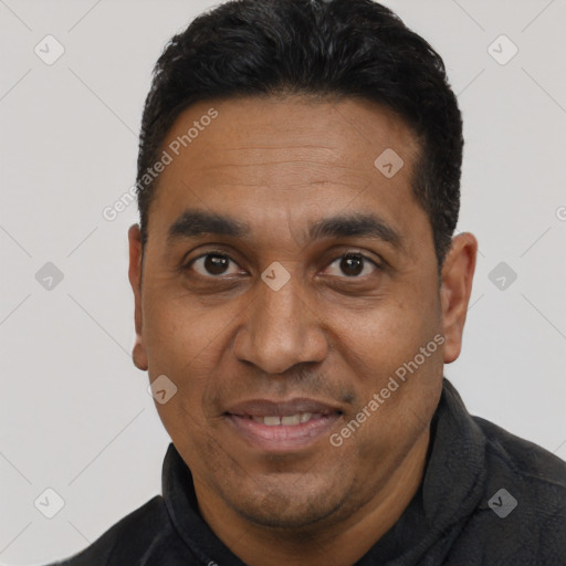 Joyful black adult male with short  black hair and brown eyes