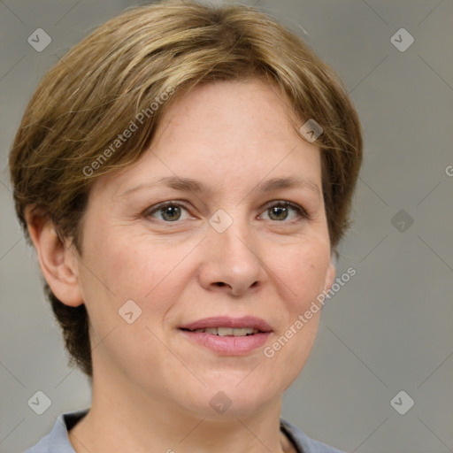 Joyful white adult female with medium  brown hair and grey eyes