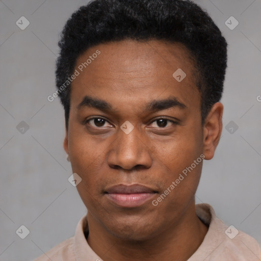 Joyful black young-adult male with short  black hair and brown eyes