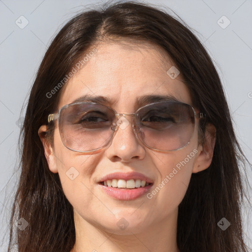 Joyful white adult female with long  brown hair and brown eyes