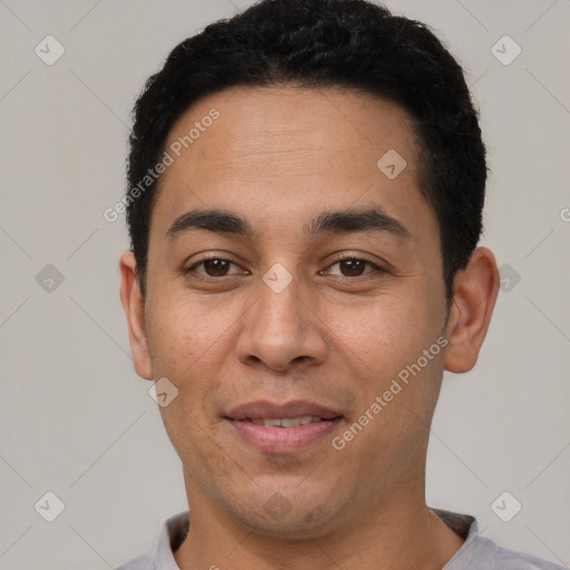 Joyful white young-adult male with short  black hair and brown eyes