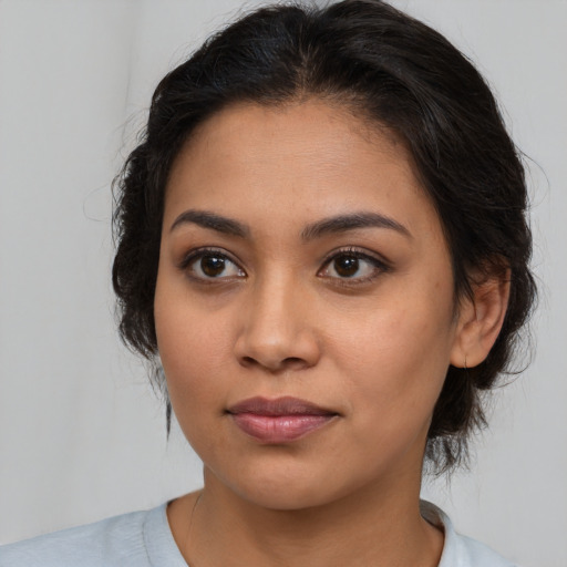 Joyful asian young-adult female with medium  brown hair and brown eyes