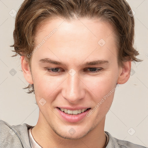 Joyful white young-adult female with short  brown hair and grey eyes