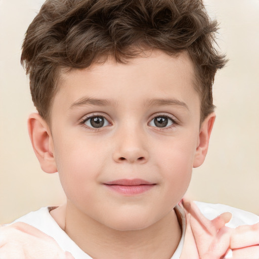 Joyful white child male with short  brown hair and brown eyes