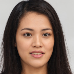 Joyful asian young-adult female with long  brown hair and brown eyes