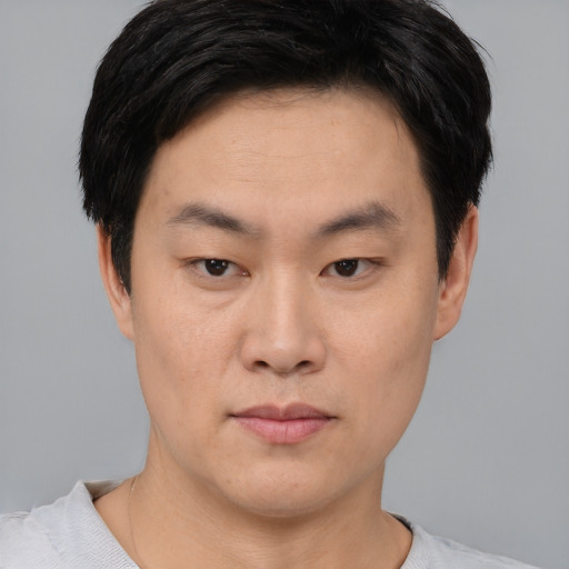 Neutral asian young-adult male with short  black hair and brown eyes