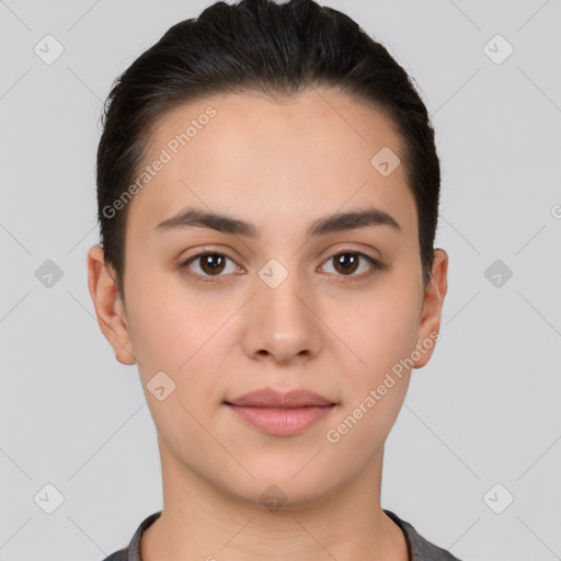 Joyful white young-adult female with short  brown hair and brown eyes