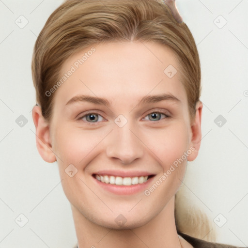 Joyful white young-adult female with short  brown hair and grey eyes