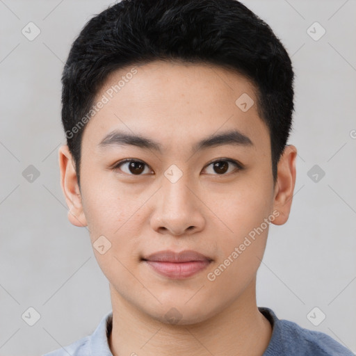 Joyful asian young-adult male with short  black hair and brown eyes