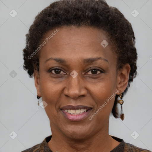 Joyful black adult female with short  brown hair and brown eyes