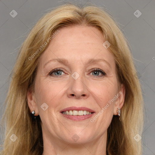 Joyful white adult female with medium  brown hair and grey eyes