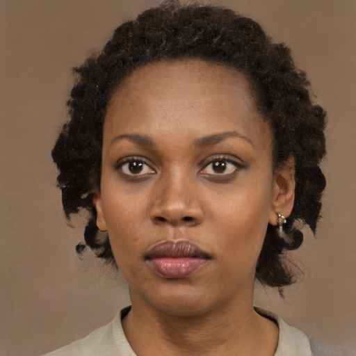 Neutral black young-adult female with medium  black hair and brown eyes