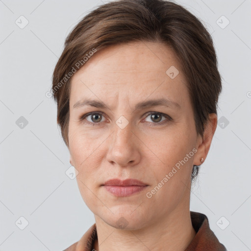 Joyful white adult female with short  brown hair and grey eyes