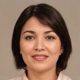 Joyful white young-adult female with medium  brown hair and brown eyes