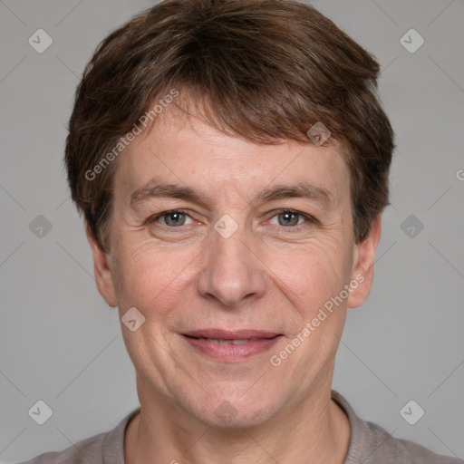 Joyful white adult male with short  brown hair and grey eyes