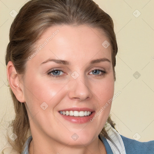 Joyful white young-adult female with medium  brown hair and blue eyes