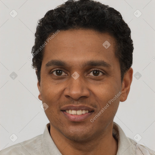 Joyful black young-adult male with short  black hair and brown eyes