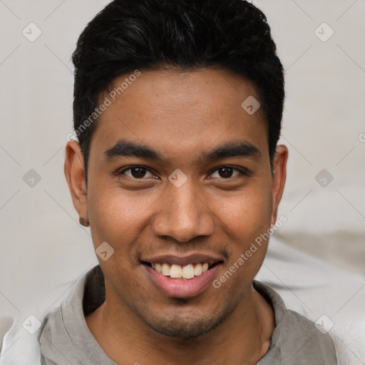 Joyful asian young-adult male with short  black hair and brown eyes