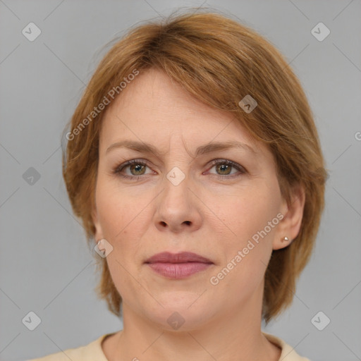 Joyful white adult female with medium  brown hair and grey eyes