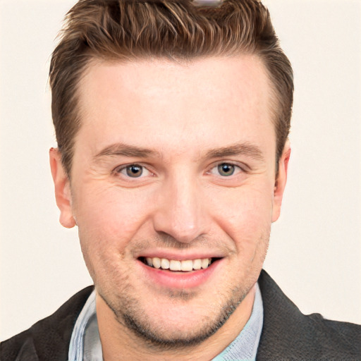 Joyful white adult male with short  brown hair and grey eyes