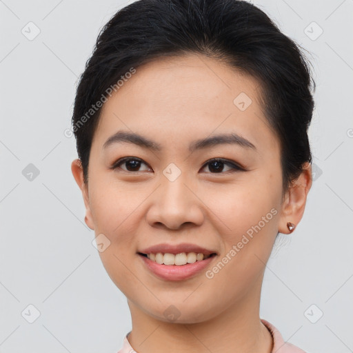 Joyful asian young-adult female with short  brown hair and brown eyes