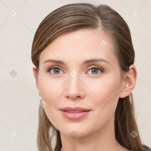 Joyful white young-adult female with long  brown hair and grey eyes