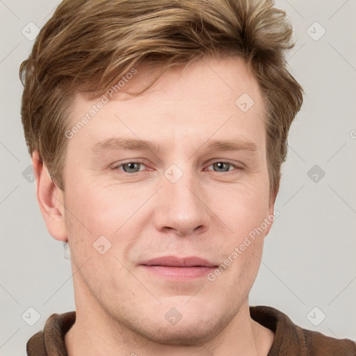 Joyful white adult male with short  brown hair and grey eyes