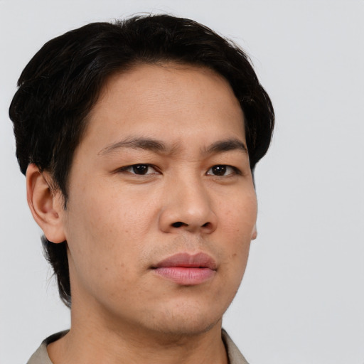 Neutral asian young-adult male with short  brown hair and brown eyes