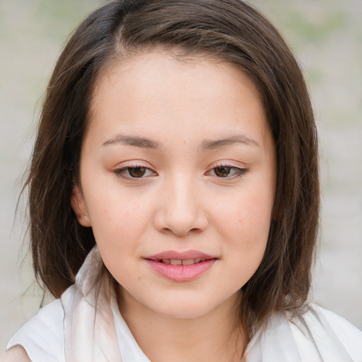 Joyful white child female with medium  brown hair and brown eyes
