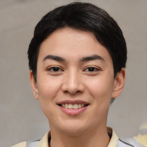 Joyful latino young-adult female with short  black hair and brown eyes