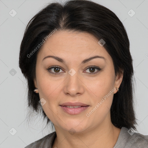 Joyful white adult female with medium  brown hair and brown eyes