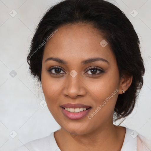 Joyful latino young-adult female with medium  brown hair and brown eyes