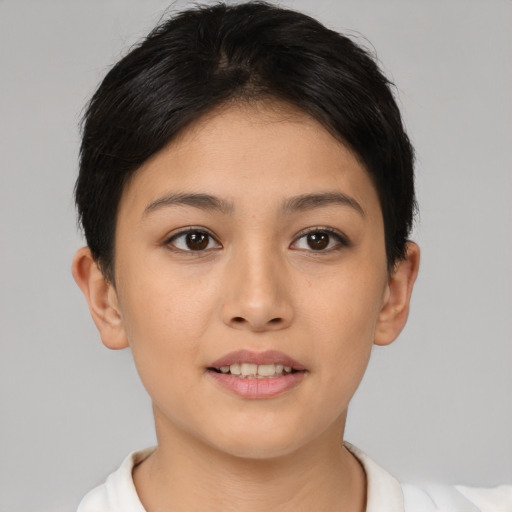 Joyful asian young-adult female with short  brown hair and brown eyes