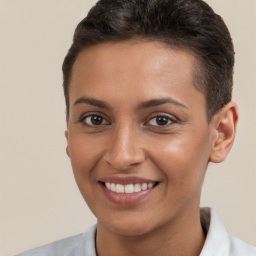 Joyful white young-adult female with short  brown hair and brown eyes