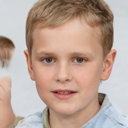 Joyful white child male with short  brown hair and grey eyes