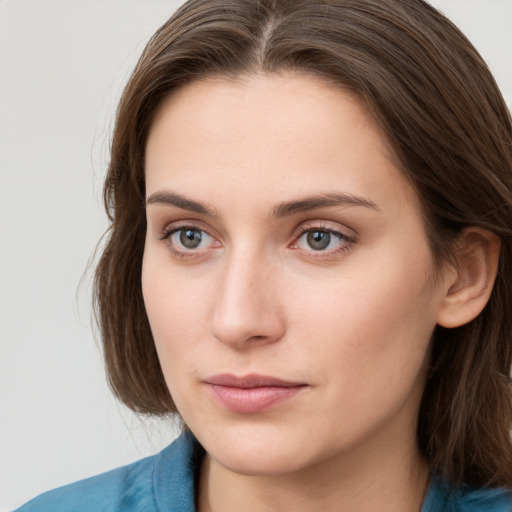 Neutral white young-adult female with medium  brown hair and blue eyes