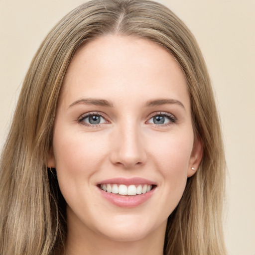 Joyful white young-adult female with long  brown hair and green eyes