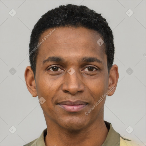 Joyful black young-adult male with short  black hair and brown eyes